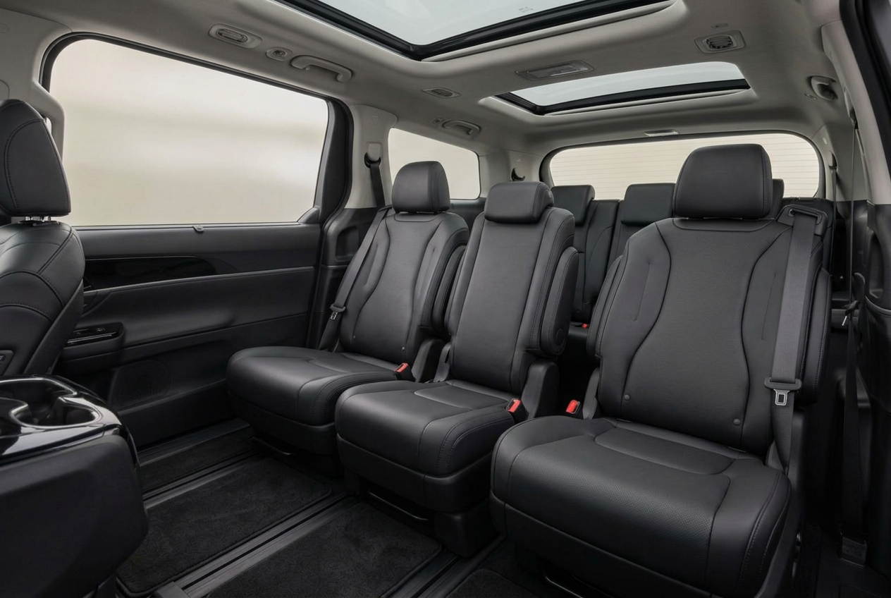 Luxury Kia Carnival interior with reclining leather seating and dual sunroofs